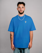 Défier oversize T-Shirt with Rooster Patch in blue