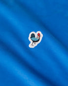 Défier oversize T-Shirt with Rooster Patch in blue